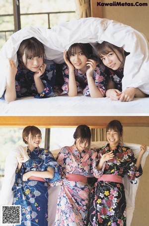 A group of young women sitting on top of a wooden bench.