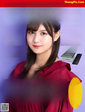 A woman in a red blouse and blue skirt posing for a magazine.
