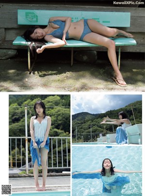 A woman in a blue bikini laying on a bench next to a pool.